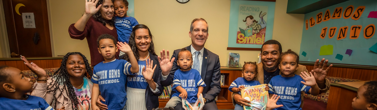 Picture of Mayor Garcetti and children at a reading event.